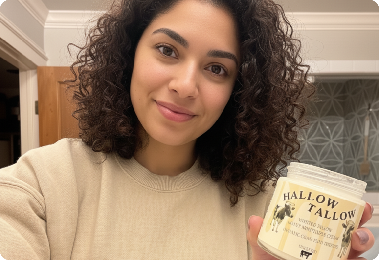 Founder holding Hallow Tallow product