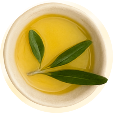 Golden olive oil with an olive-leaf sprig