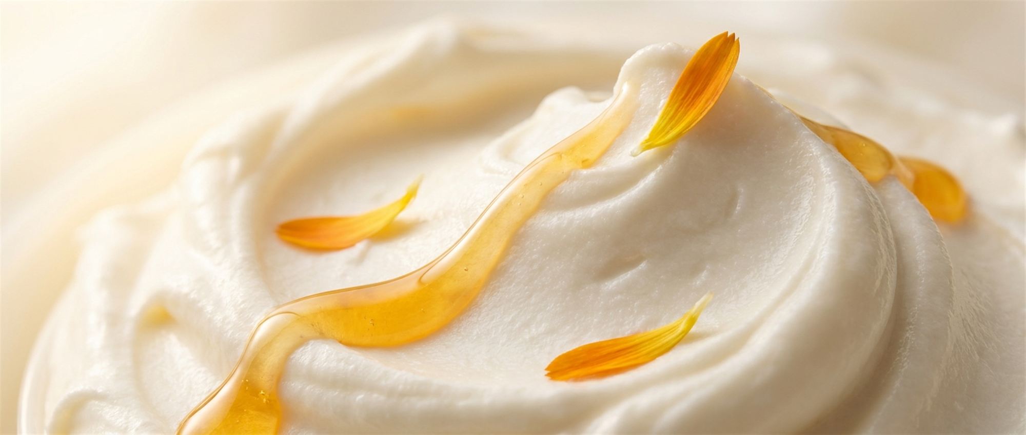 Whipped tallow pulled into soft peaks, lit with warm golden light